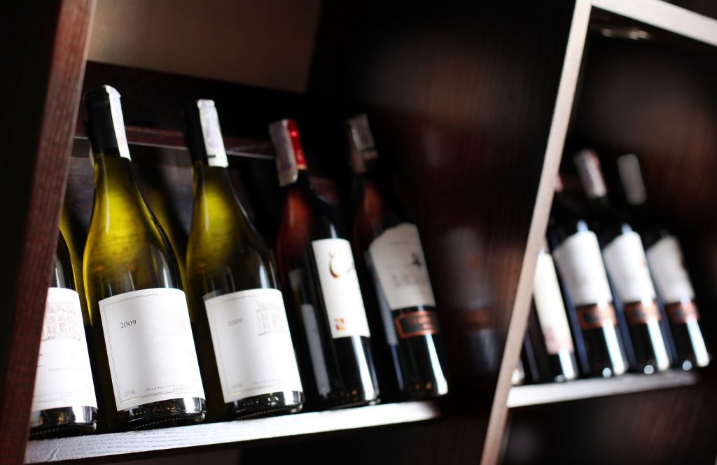 bigstock-Wine-bottles-on-a-wooden-shelf-38829250.jpg
